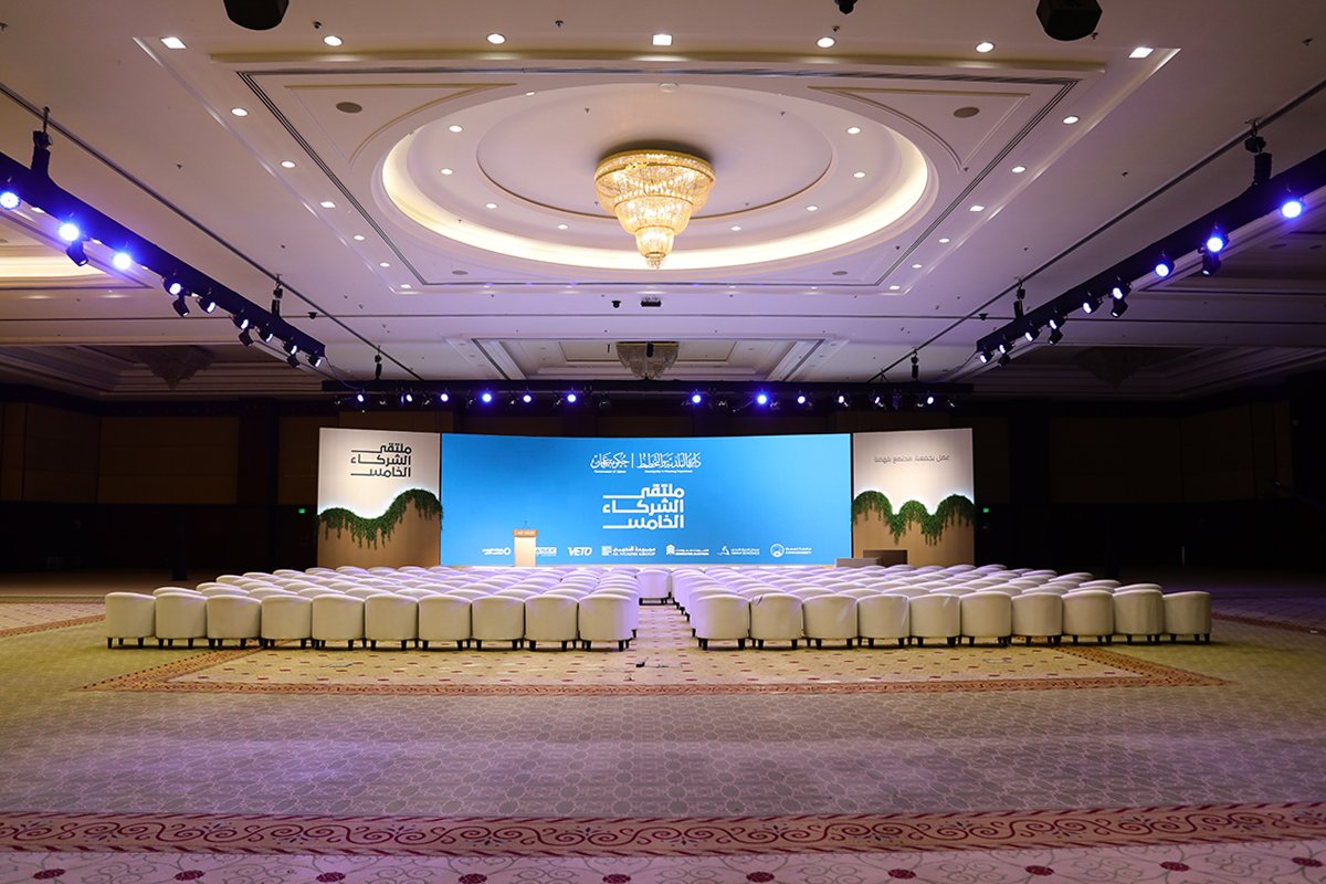 Elegant corporate event stage and branding décor