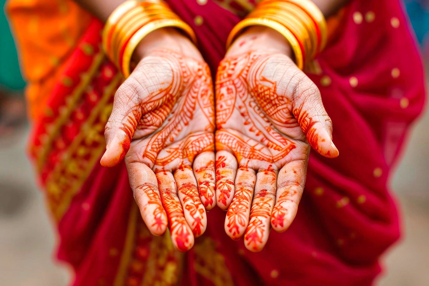 Colourful Mehandi ceremony décor with florals and seating